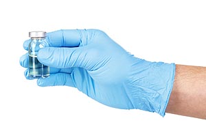 Hands With Blue Gloves Holding An Ampoule